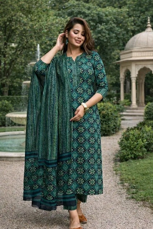 Full-length view of a green printed kurti with matching pants and dupatta